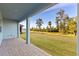 Covered patio overlooking a large grassy backyard at 1005 Signet, Apollo Beach, FL 33572