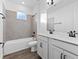 Bathroom with a bathtub, double vanity, and modern finishes at 1005 Signet, Apollo Beach, FL 33572