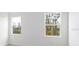 Well-lit bedroom with large windows offering a view of the outdoors at 1005 Signet, Apollo Beach, FL 33572
