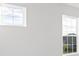 Bright interior with two large windows and neutral walls at 1005 Signet, Apollo Beach, FL 33572