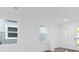 Bright and airy living room with large windows and hardwood floors at 1005 Signet, Apollo Beach, FL 33572