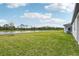 Spacious backyard with a lake view at 494 Sun Chaser Dr, Nokomis, FL 34275