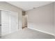 Bedroom with carpet, double doors to closet and access to another room at 494 Sun Chaser Dr, Nokomis, FL 34275