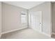 Well-lit bedroom with carpet flooring and closet with sliding doors at 494 Sun Chaser Dr, Nokomis, FL 34275