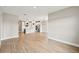 Open concept dining room with kitchen and wood-look tile flooring at 494 Sun Chaser Dr, Nokomis, FL 34275