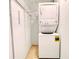 Small laundry room with stackable washer and dryer set at 6165 Chesham Dr # 3, New Port Richey, FL 34653