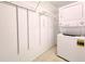 Laundry closet with stackable washer and dryer, and shelving at 6165 Chesham Dr # 3, New Port Richey, FL 34653