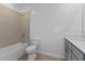 Clean bathroom with a bathtub, toilet and vanity at 17355 Peregrine Way, Punta Gorda, FL 33982