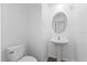 Simple, half bathroom with pedestal sink and toilet at 17343 Peregrine Way, Punta Gorda, FL 33982