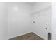 Laundry room with vinyl flooring and overhead shelving at 17343 Peregrine Way, Punta Gorda, FL 33982