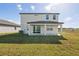 Large backyard with covered patio and grassy area at 101 Runaway Field Ave, Nokomis, FL 34275