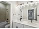 Modern bathroom with double vanity and a shower/tub combo at 101 Runaway Field Ave, Nokomis, FL 34275