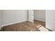 Spacious bedroom with wood-look tile floors and an adjacent room at 101 Runaway Field Ave, Nokomis, FL 34275