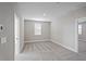 Simple bedroom with carpeted floors and window at 101 Runaway Field Ave, Nokomis, FL 34275