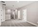 Upstairs hallway with carpeted floors and multiple doors at 101 Runaway Field Ave, Nokomis, FL 34275