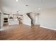 Open concept living room with hardwood floors and access to kitchen at 101 Runaway Field Ave, Nokomis, FL 34275