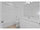 Clean bathroom featuring a shower/tub combo and modern vanity at 9572 Vibrant Lane, Venice, FL 34292