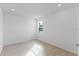 Bright bedroom with tile floors and a window offering natural light at 9572 Vibrant Lane, Venice, FL 34292