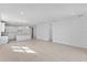 Open living room and kitchen area with tile floors at 9572 Vibrant Lane, Venice, FL 34292