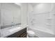 Clean bathroom with tub, shower, and granite vanity at 37488 Williamette Way, Zephyrhills, FL 33540