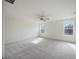 Large bedroom with ceiling fan and plush carpeting at 37488 Williamette Way, Zephyrhills, FL 33540