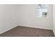 Well-lit bedroom featuring carpet and a window with blinds at 396 Lazy Shore Dr, Nokomis, FL 34275