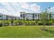 Community view showcasing neighboring apartment buildings at 396 Lazy Shore Dr, Nokomis, FL 34275