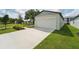 Attached garage with white door and driveway at 396 Lazy Shore Dr, Nokomis, FL 34275