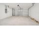 Spacious garage with overhead door and ample storage space at 396 Lazy Shore Dr, Nokomis, FL 34275