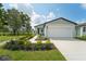 Charming one-story house with a two-car garage and landscaped yard at 396 Lazy Shore Dr, Nokomis, FL 34275