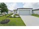 One-story home with attached garage and landscaped front yard at 428 Lazy Shore Dr, Nokomis, FL 34275