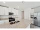 Modern kitchen with granite countertops and white cabinets at 428 Lazy Shore Dr, Nokomis, FL 34275