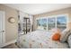 Bedroom with water view, king bed, and access to balcony at 6268 Palma Del Mar S Blvd # 204, St Petersburg, FL 33715