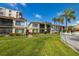 Rear view of condo showing patio and waterfront access at 6268 Palma Del Mar S Blvd # 204, St Petersburg, FL 33715