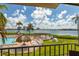 Stunning view of the pool and bay from a condo balcony at 6268 Palma Del Mar S Blvd # 204, St Petersburg, FL 33715