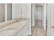 Spacious bathroom featuring double sinks, granite countertops, and tile flooring at 14009 Crutchfield Ct, Parrish, FL 34219