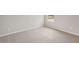 An airy bedroom provides neutral walls, plush carpet, and bright light at 14009 Crutchfield Ct, Parrish, FL 34219