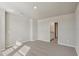 Bedroom with carpet, neutral colored walls, and door to bathroom at 14009 Crutchfield Ct, Parrish, FL 34219