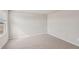 A light filled bedroom offers a neutral color palette and plush carpeting at 14009 Crutchfield Ct, Parrish, FL 34219