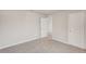 Empty bedroom features neutral walls and carpet, with an access to the hallway at 14009 Crutchfield Ct, Parrish, FL 34219