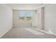 Bedroom with carpet, neutral colored walls, and dual windows with blinds at 14009 Crutchfield Ct, Parrish, FL 34219