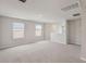 Bright bonus room with natural light from windows, neutral walls and carpet at 14009 Crutchfield Ct, Parrish, FL 34219