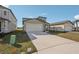 Inviting single-Gathering home with a spacious driveway, two-car garage, and pristine front yard at 14009 Crutchfield Ct, Parrish, FL 34219