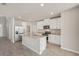 Modern kitchen boasting stainless steel appliances, granite countertops, and a functional island for meal prep at 14009 Crutchfield Ct, Parrish, FL 34219