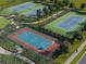 Aerial view of tennis and multi-purpose sports courts at 156 Lazy Shore Dr, Nokomis, FL 34275