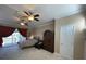 Main bedroom with two ceiling fans and large windows at 13213 Palmilla Cir, Dade City, FL 33525