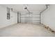 Empty garage with white walls and concrete floor at 432 Lazy Shore Dr, Nokomis, FL 34275