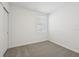 Well-lit bedroom featuring carpet and window with blinds at 436 Lazy Shore Dr, Nokomis, FL 34275