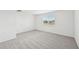 Spacious bedroom with window and grey carpet at 14023 Ginnie Springs Way, Parrish, FL 34219