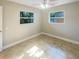 Spacious bedroom with tile floors and ceiling fan at 4185 Barracuda Se Dr, St Petersburg, FL 33705
